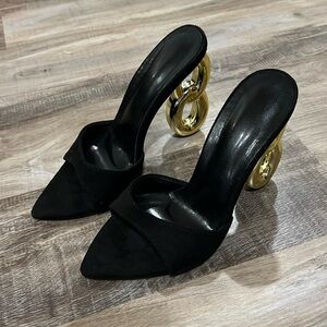 Never worn black with gold decorative heel size 37